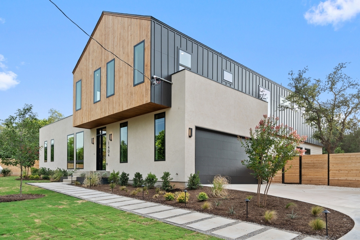 Angled exterior showcasing mixed materials on a custom home in Austin, TX