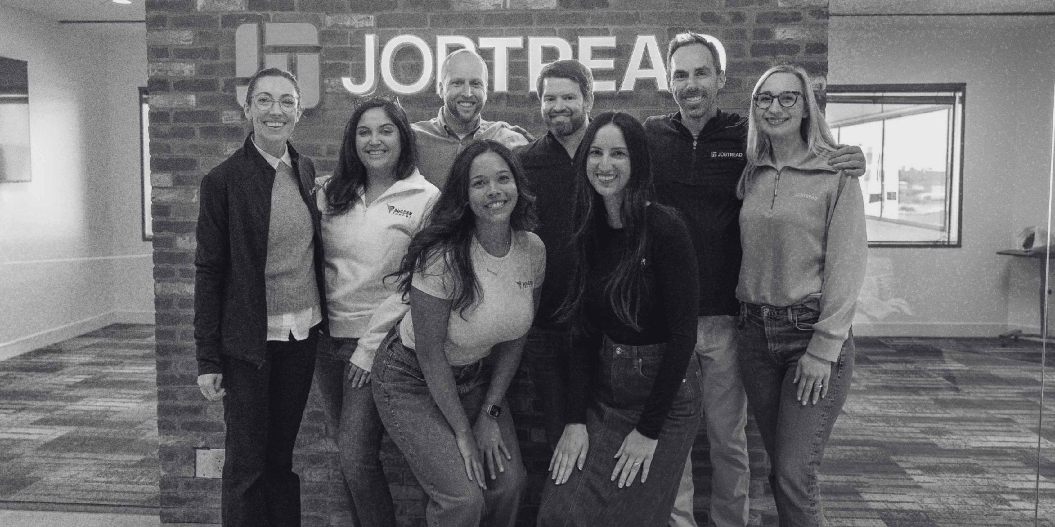 Black and white image of Builder Funnel team members at JobTread.