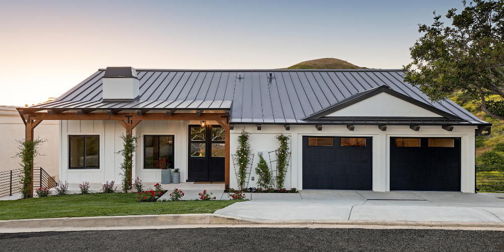 Modern Farmhouse Home at Sunset with Black Roof