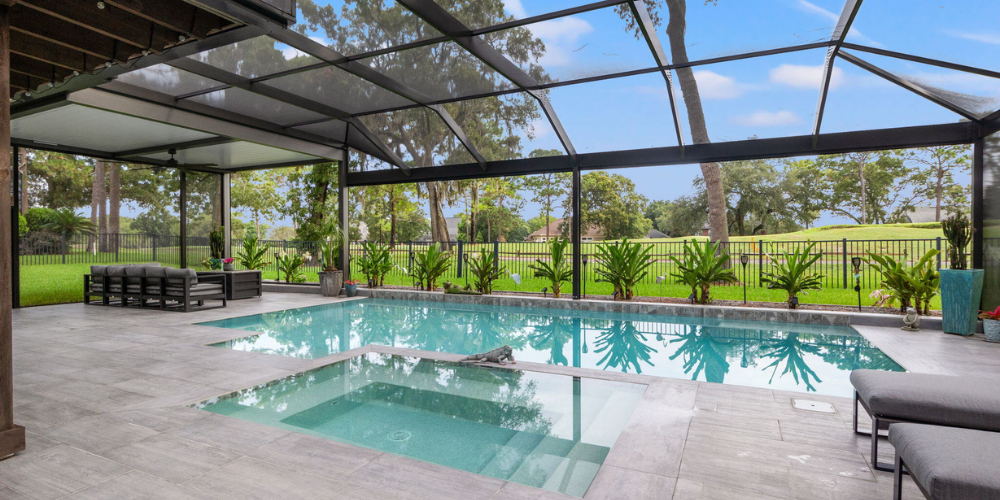 Outdoor Pool Enclosure with Beautiful Pool and Hot Tub