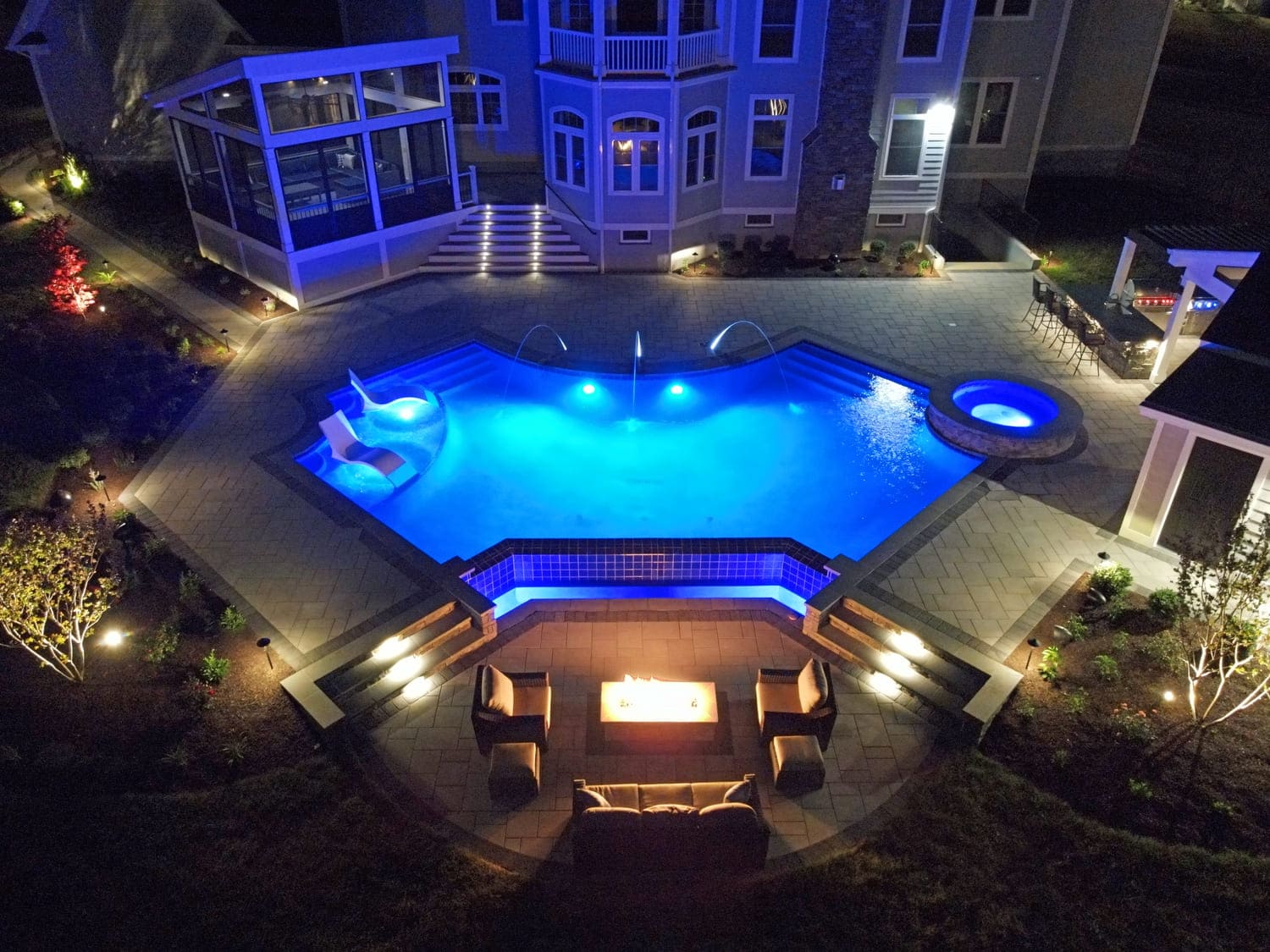 aerial-view-of-pool-patio-porch-and-deck-at-night